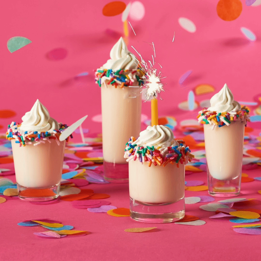 Shots of UV Cake Vodka with a sparkler